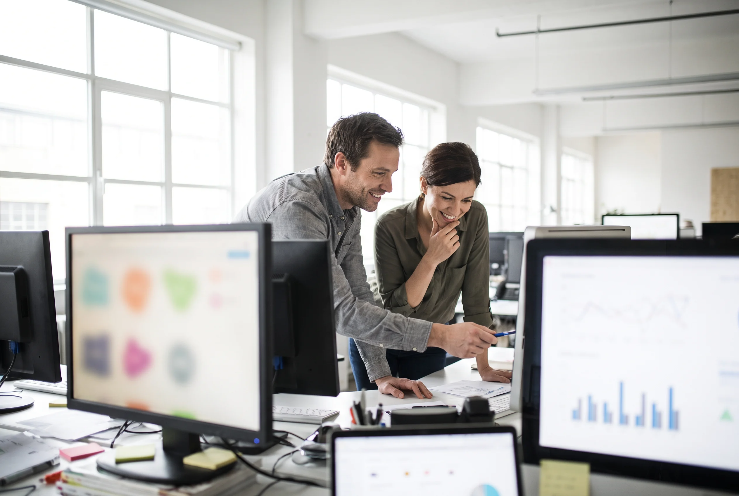 Colleagues reviewing abstract marketing data
